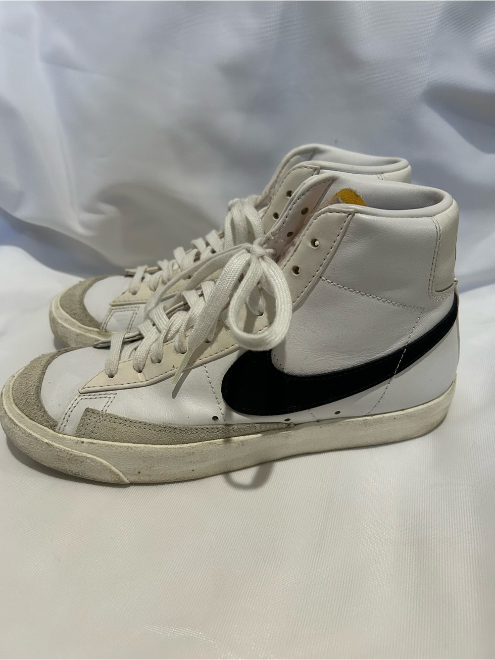 Nike White High-Top Sneakers with Black Swoosh